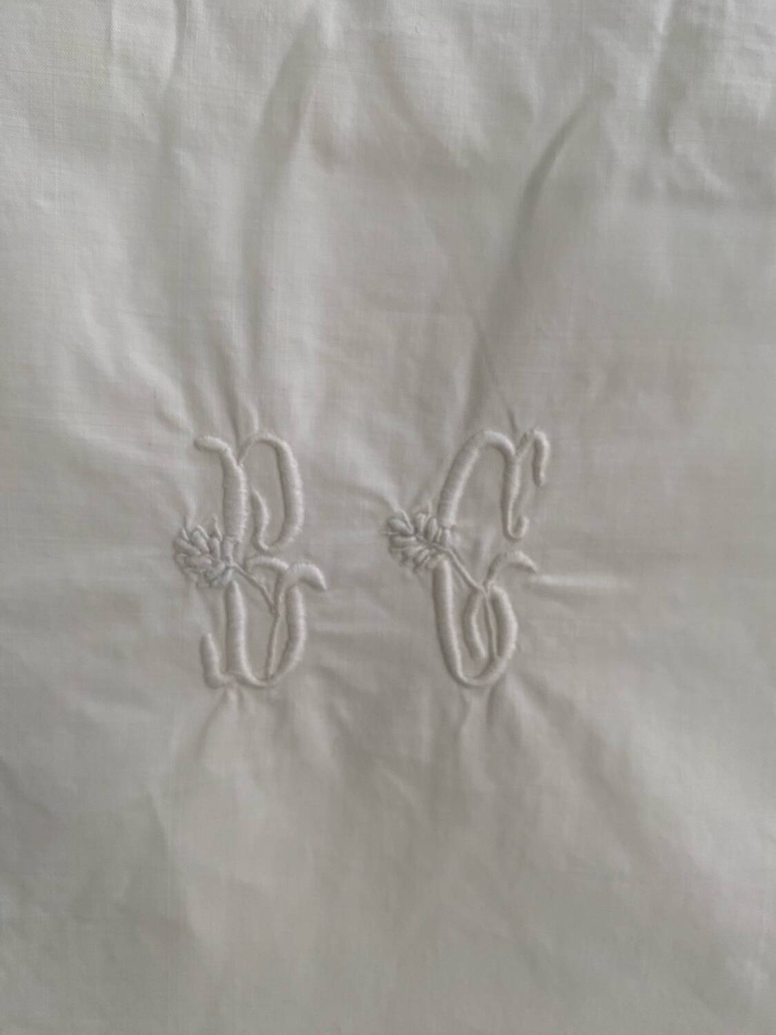 White cotton pillowcase with monogram BC.