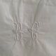 White cotton pillowcase with monogram BC.