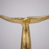 Solid brass dolphin console feet.