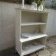 Vintage library enhanced in beige, wooden top.