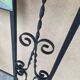 Large vintage wall coat rack in wrought iron with mirror and shelf.
