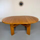 Extendable round table Maison Regain in solid elm, 1970s design.