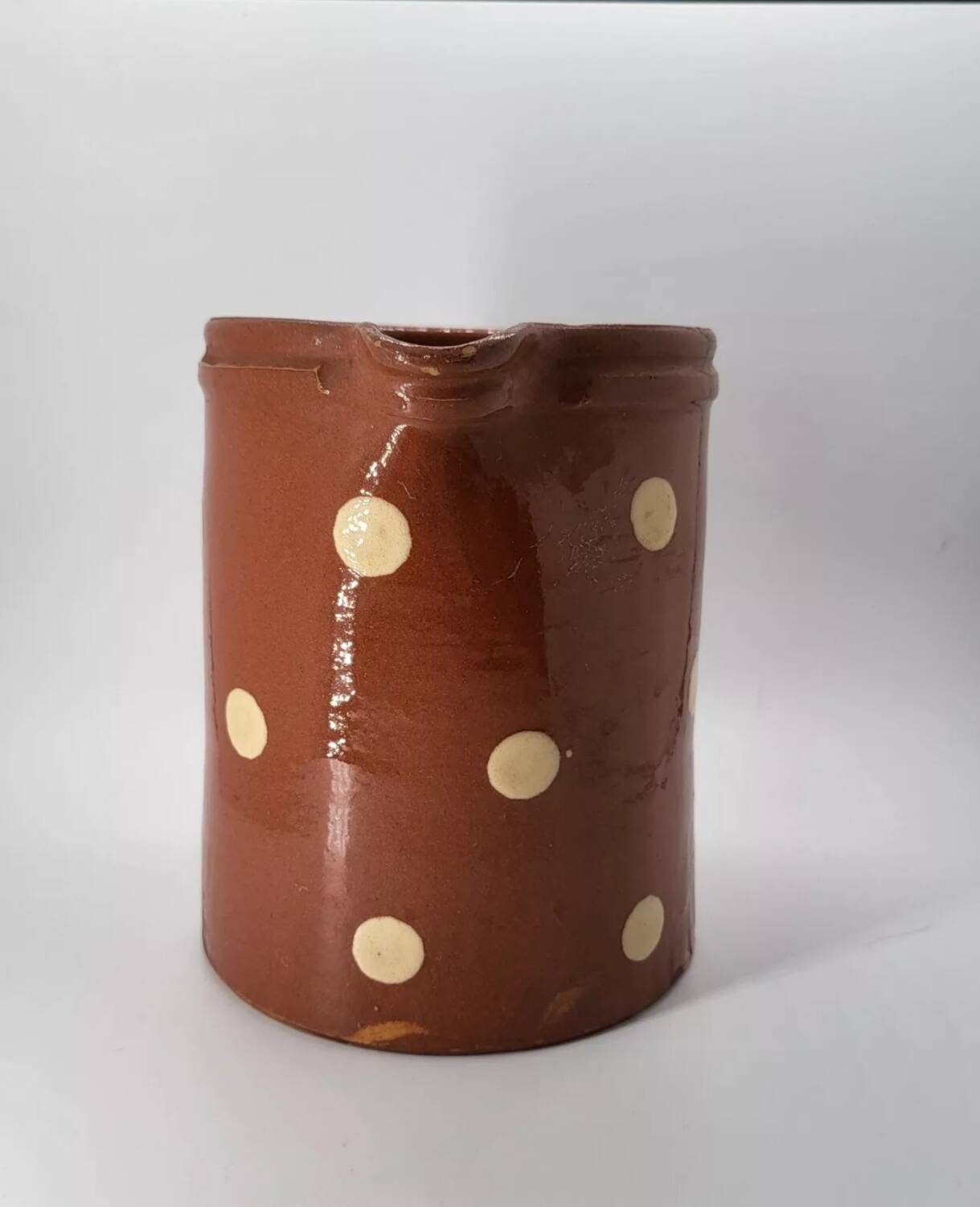 Old pitcher with polka dots savoyard pottery in glazed terracotta alsace