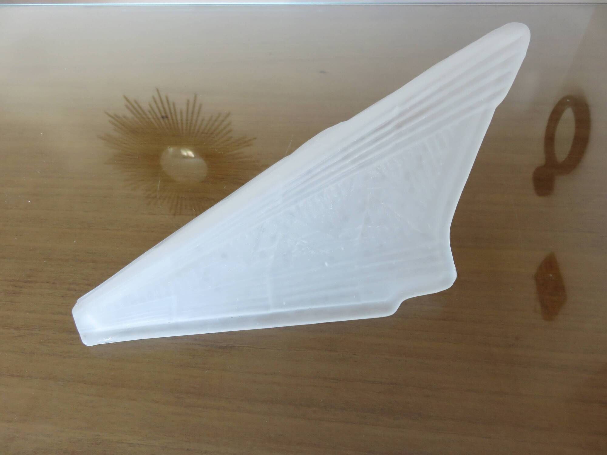 Art Deco wall light in brass and thick frosted glass.