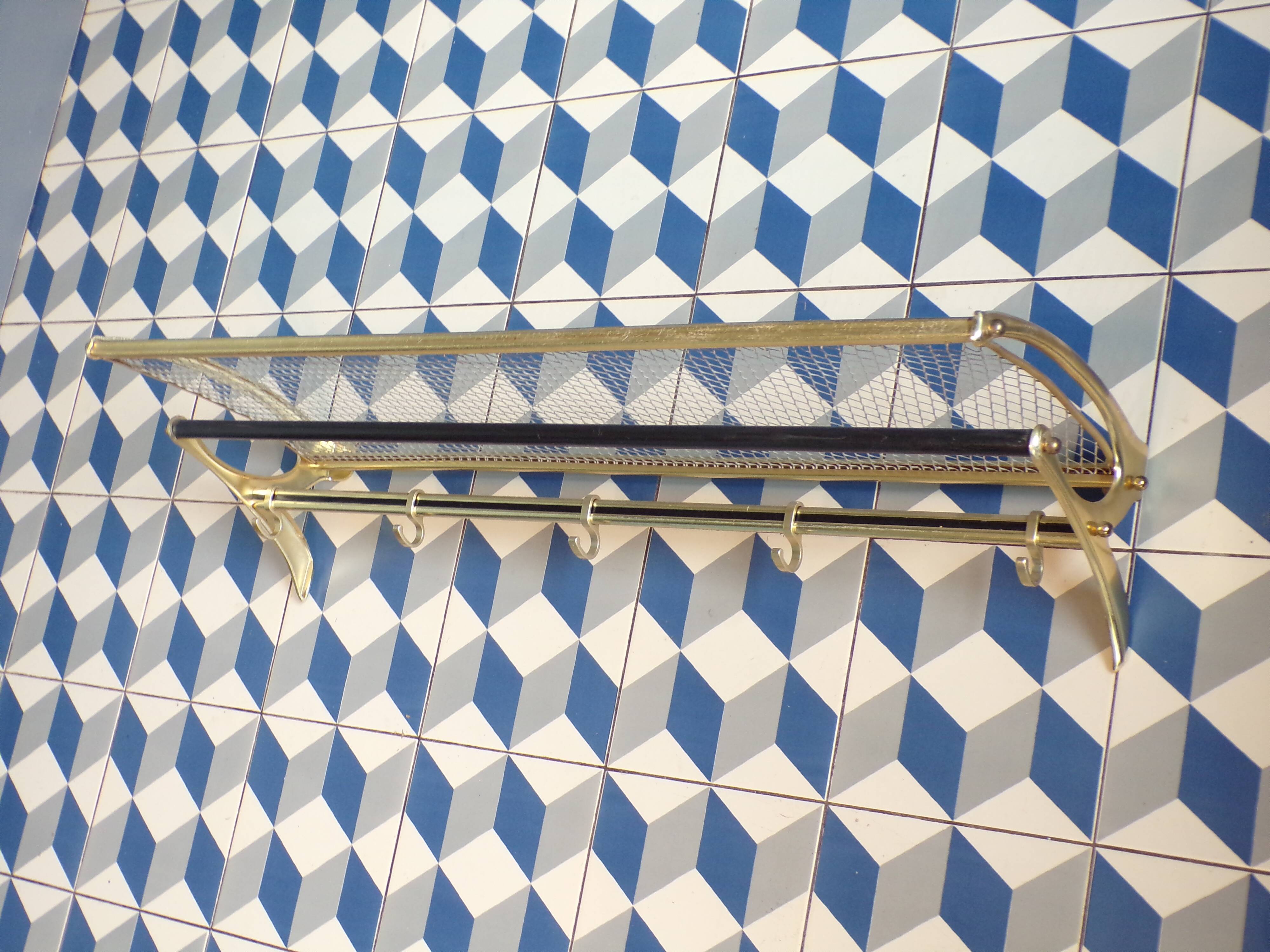 Vintage coat rack in the style of a train luggage rack.