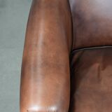 Great luxurious brown cowhide club armchair with matching piping