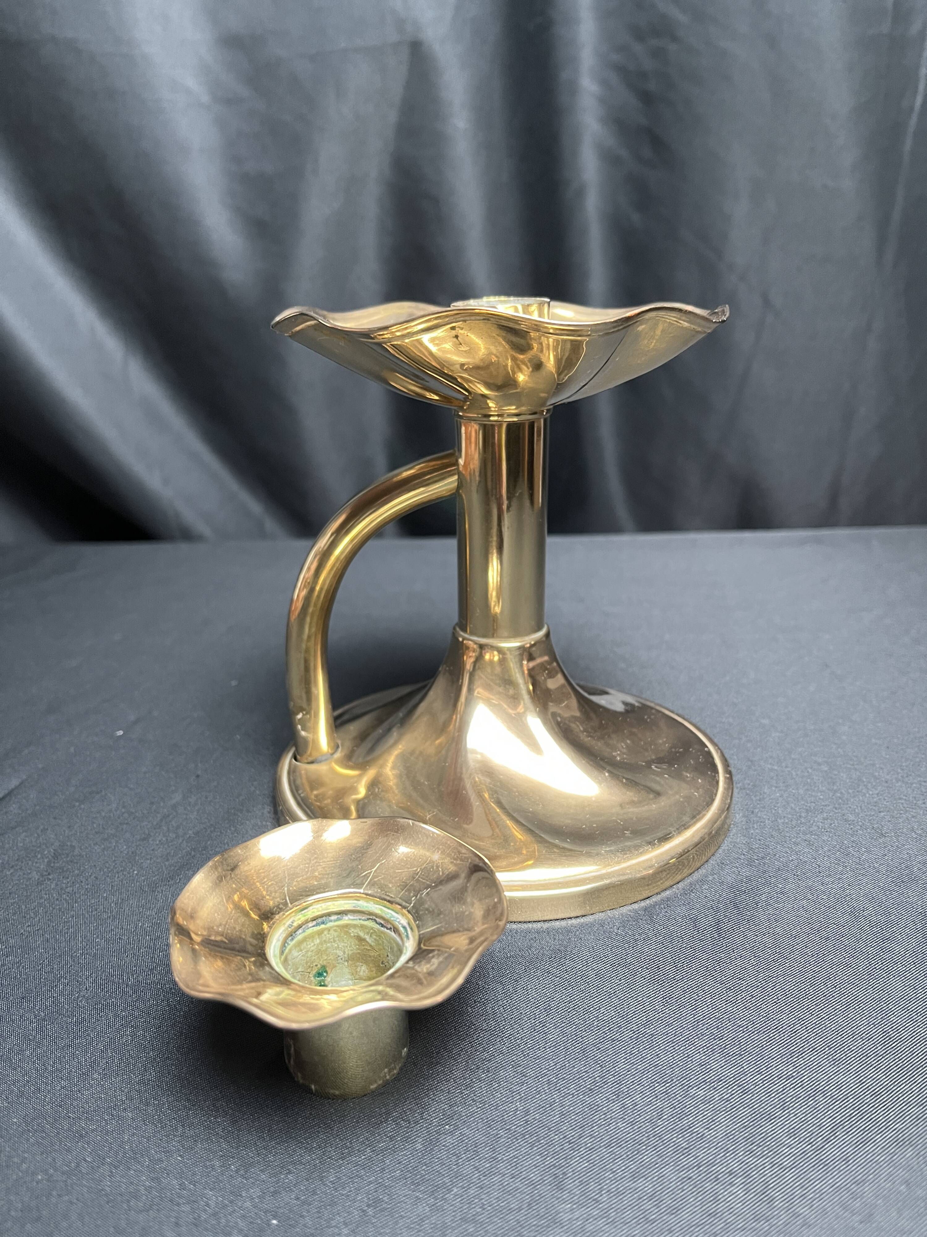 Brass candlestick in a fluted shape from the early 20th century.