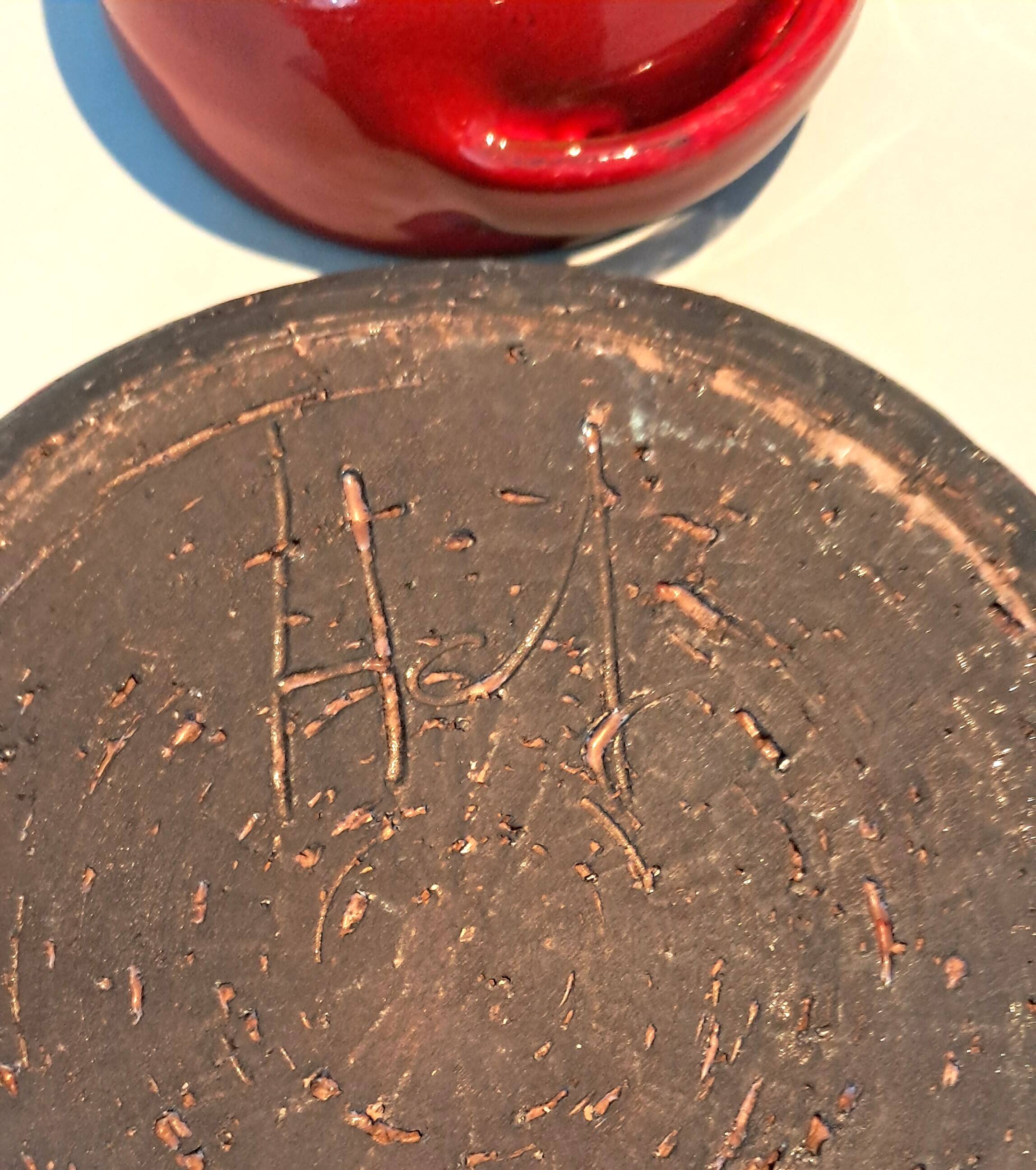 Red ceramic pieces by Gérard Hoffman (1917/1965).