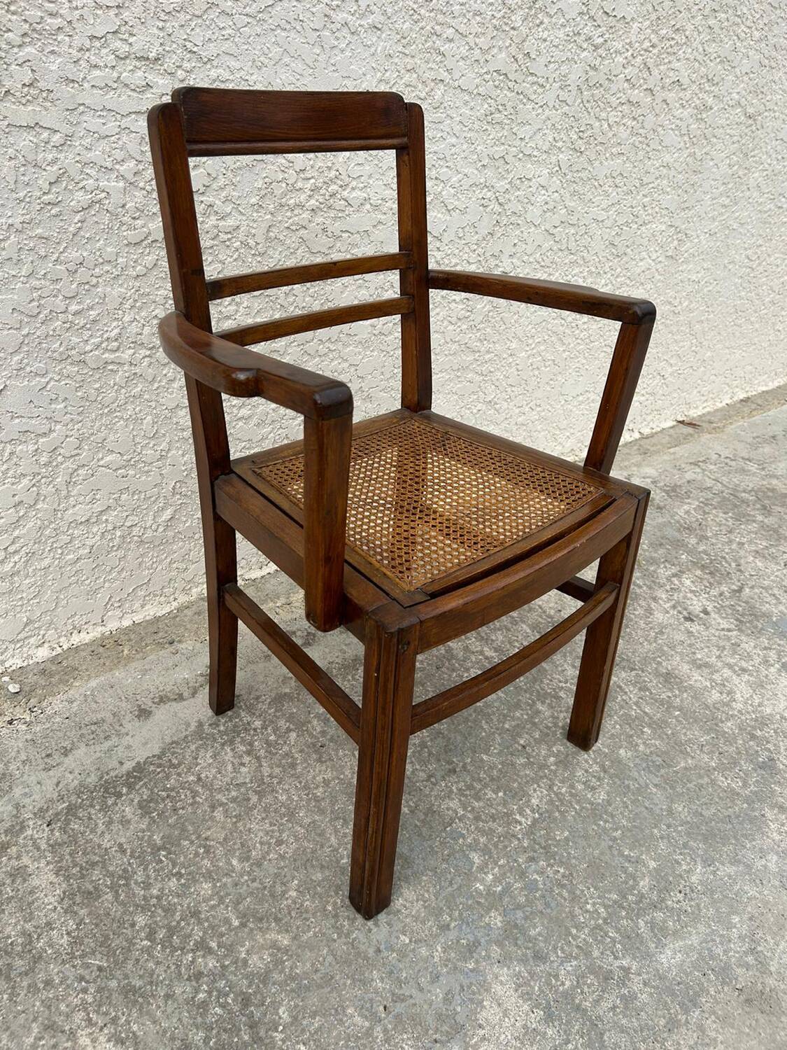 Cane armchair with armrests
