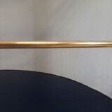 Armoire à barre vintage en forme de cylindre ouvrable, bois, laiton et verre.