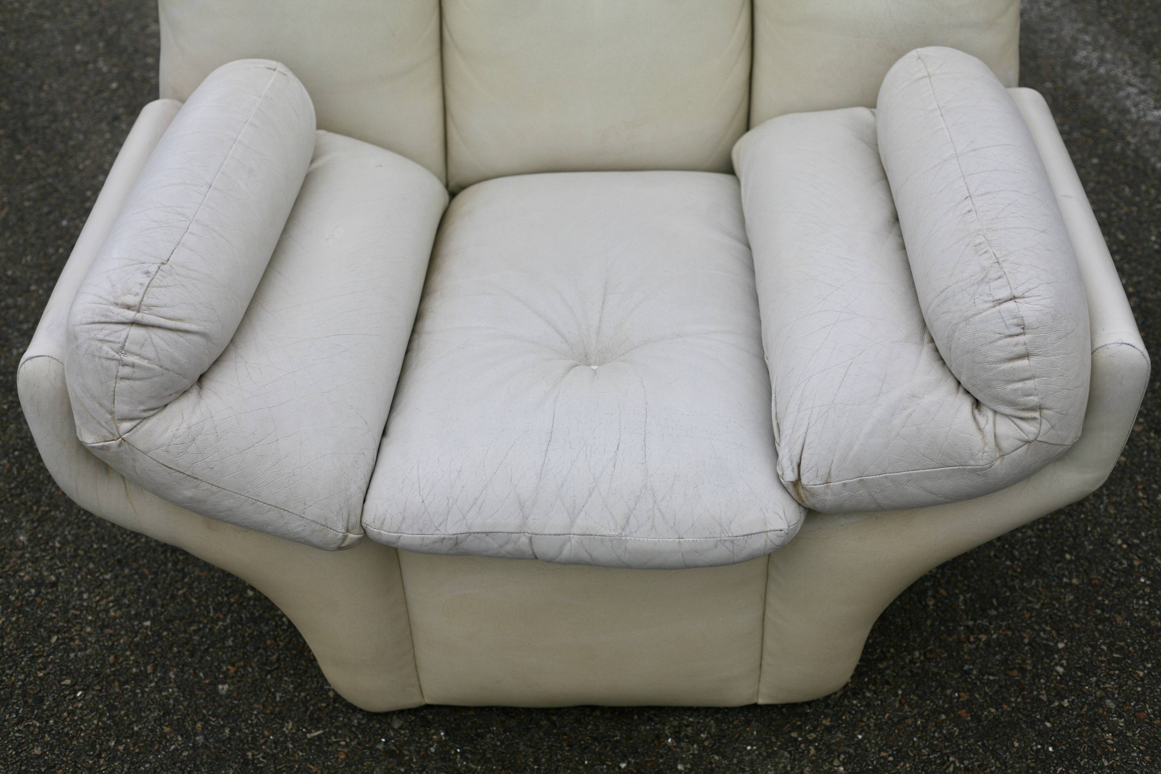 Pair of leather “space age” armchairs. Cream colour". Circa 1970.