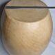 Brutalist monoxyle stool in solid mango wood with an organic shape.