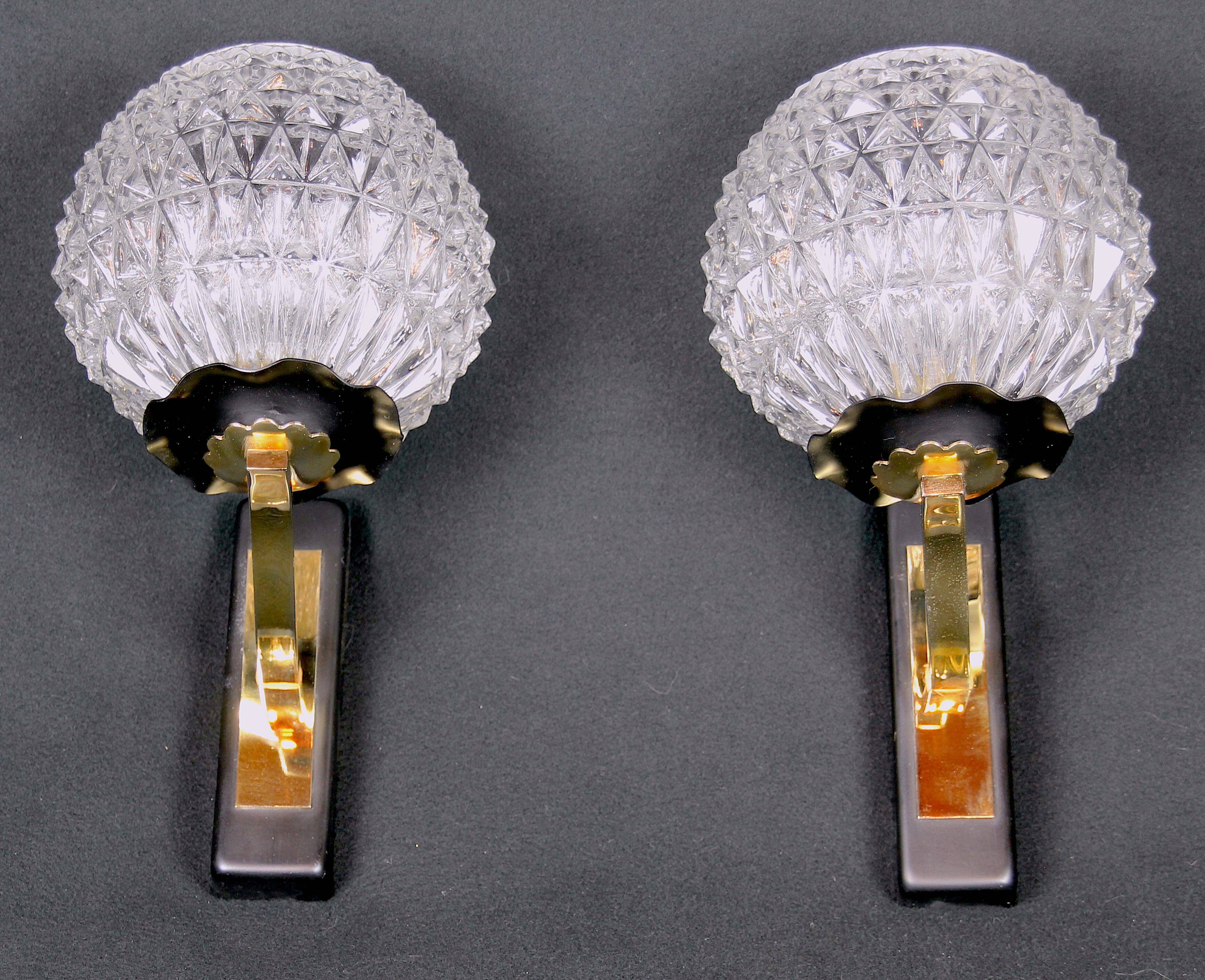 Maison Arlus Pair of brass and black wall sconces, France Mid-Century