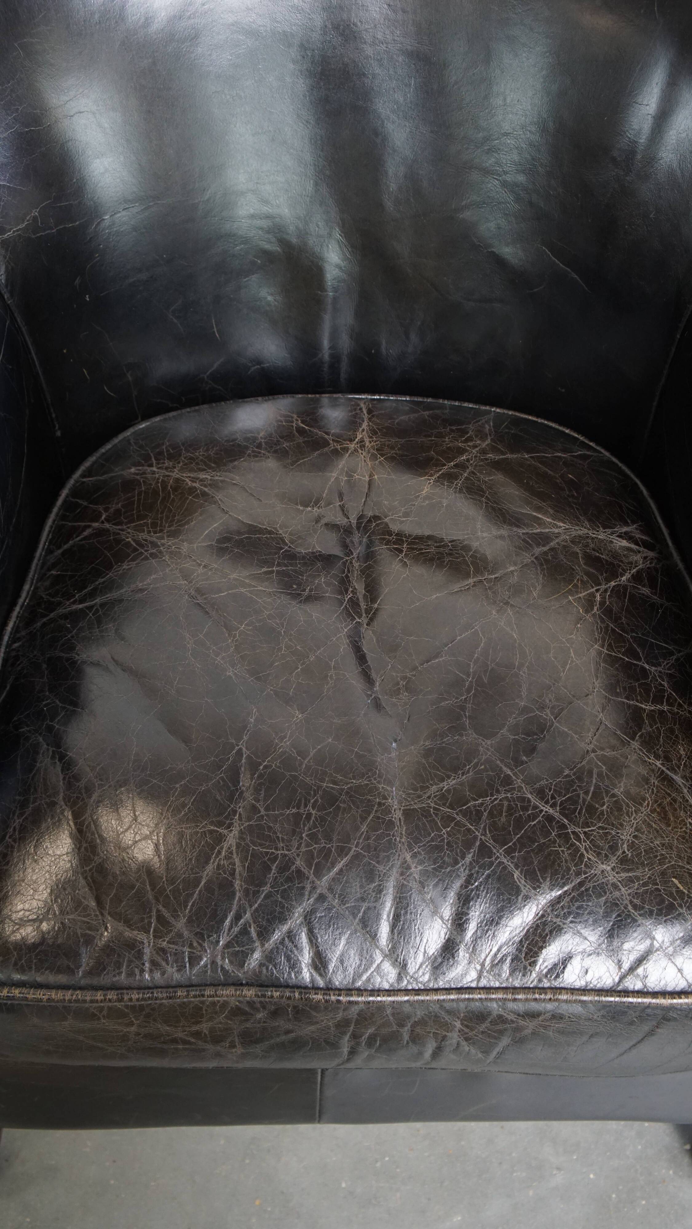 Black cowhide leather armchair
