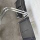 Vintage cantilever chairs in black saddle leather and chrome.