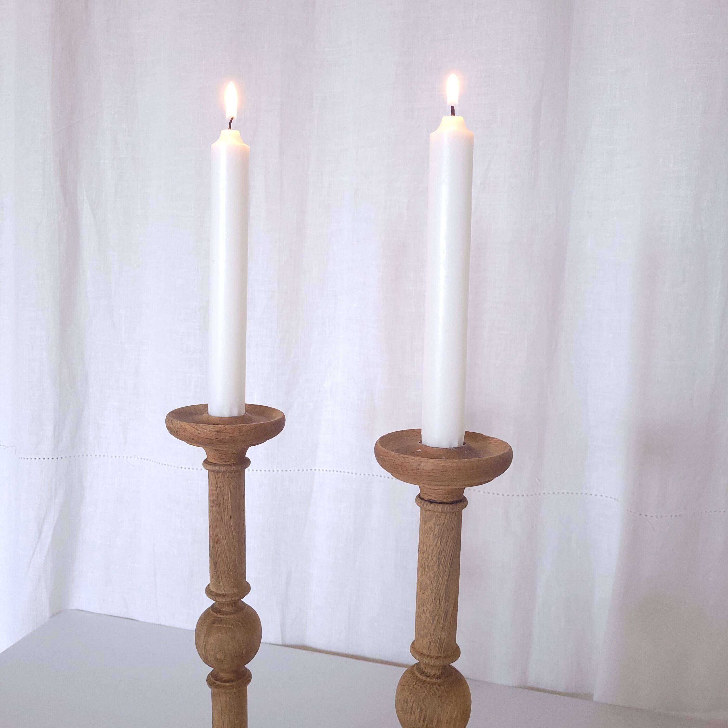 Large carved wooden candlesticks