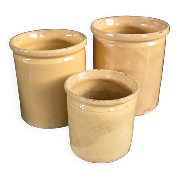 Trio of ancient pots in yellow glazed terracotta.