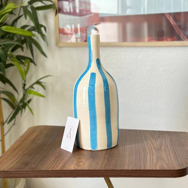 Artisanal vase, sky blue striped bottle.