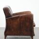 Sleekly shaped timeless design armchair made of sheepskin leather
