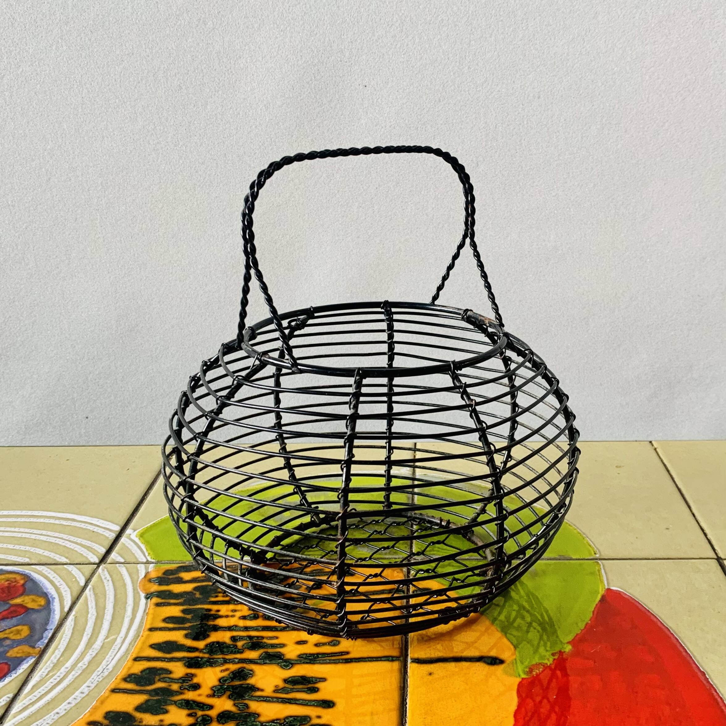 Vintage black metal egg basket