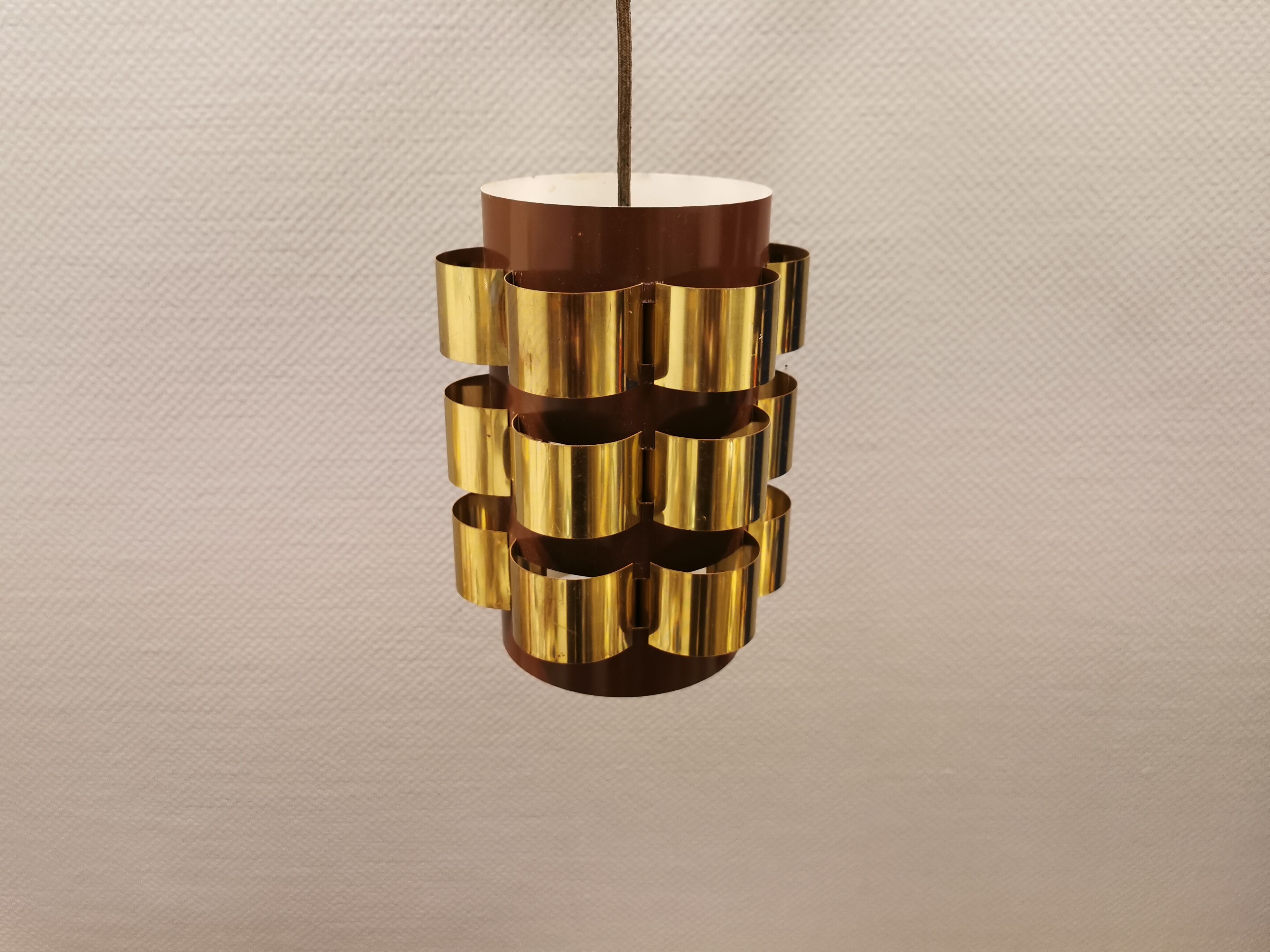 Danish hanging lamp from the 70s, in thin cut metal.