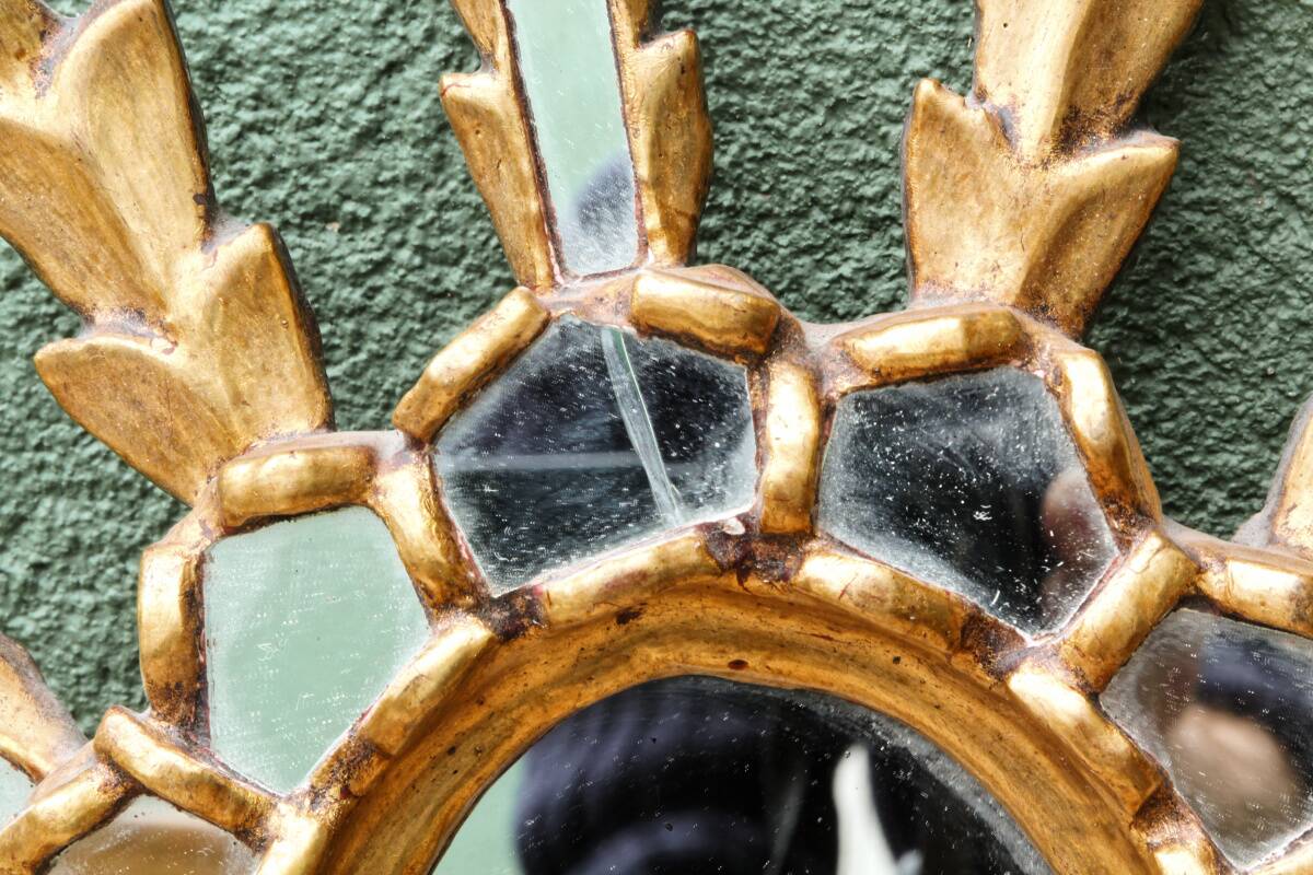 Sun mirror with parecloses, carved wood