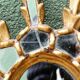 Sun mirror with parecloses, carved wood