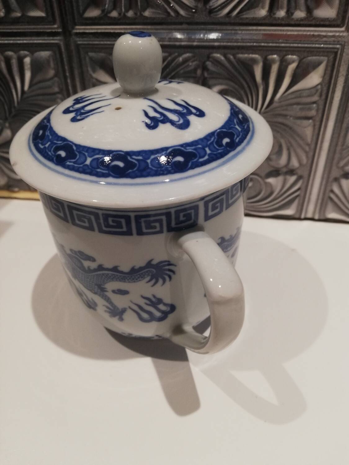 Tea mug with Chinese lid.