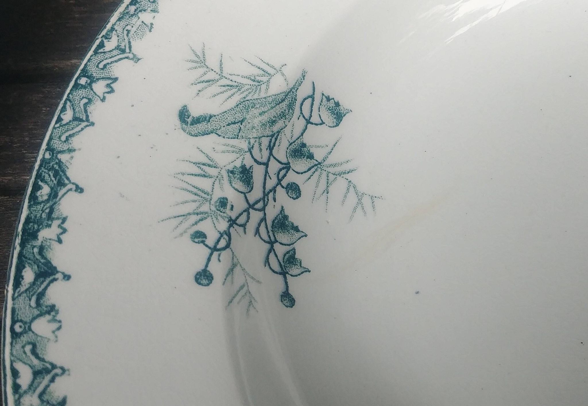 Set of three iron earthenware plates from the St Amandinoise earthenware factory, lily of the valley model.