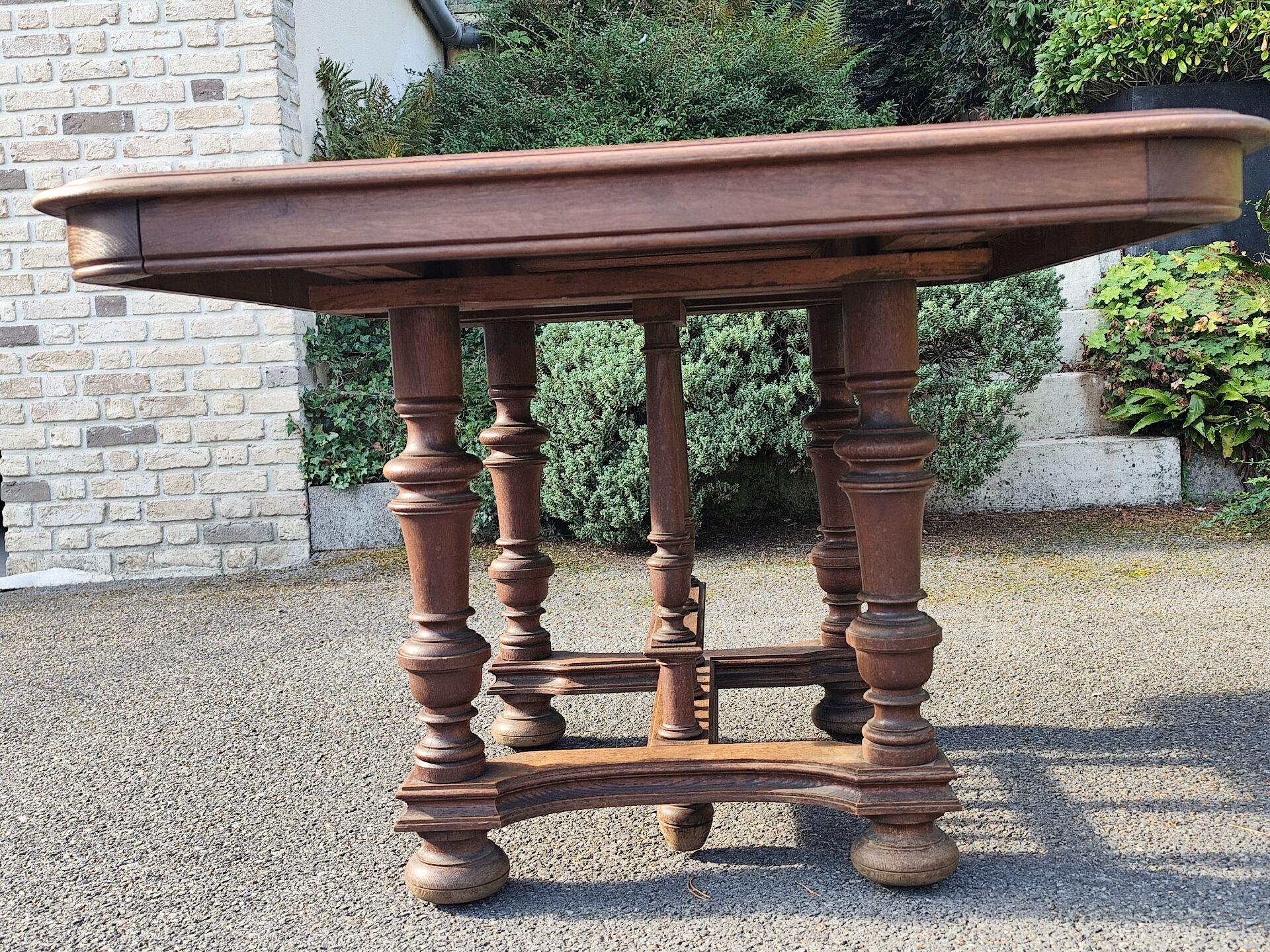Square wooden table in Henri II style.