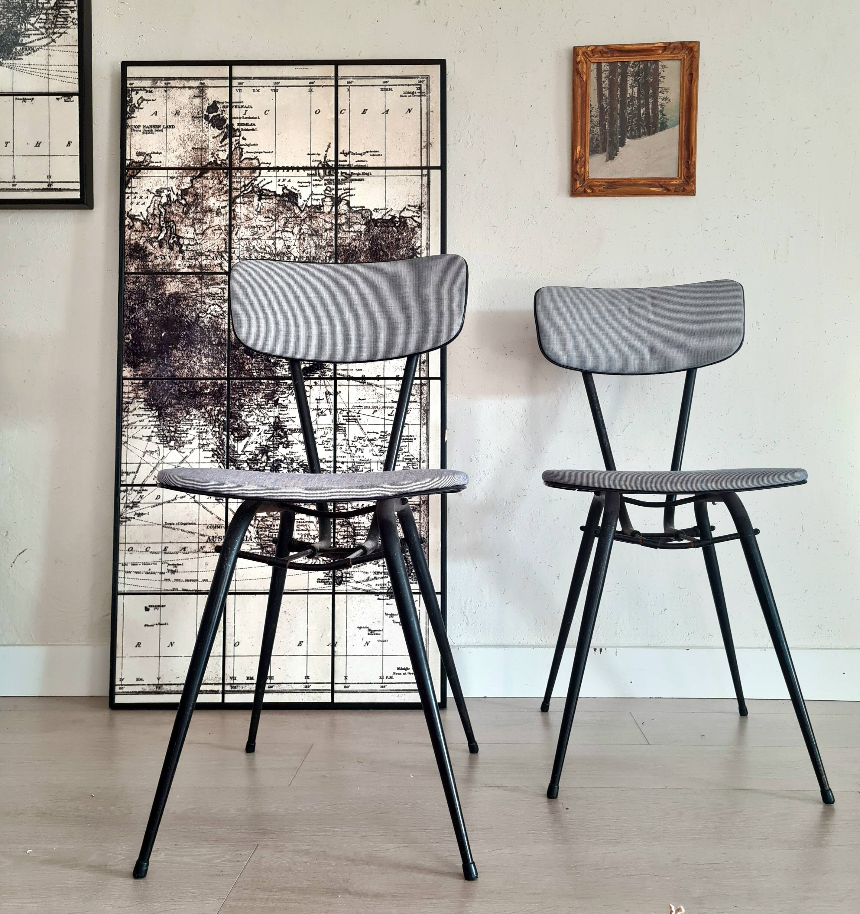 Pair of black metal and blue fabric chairs