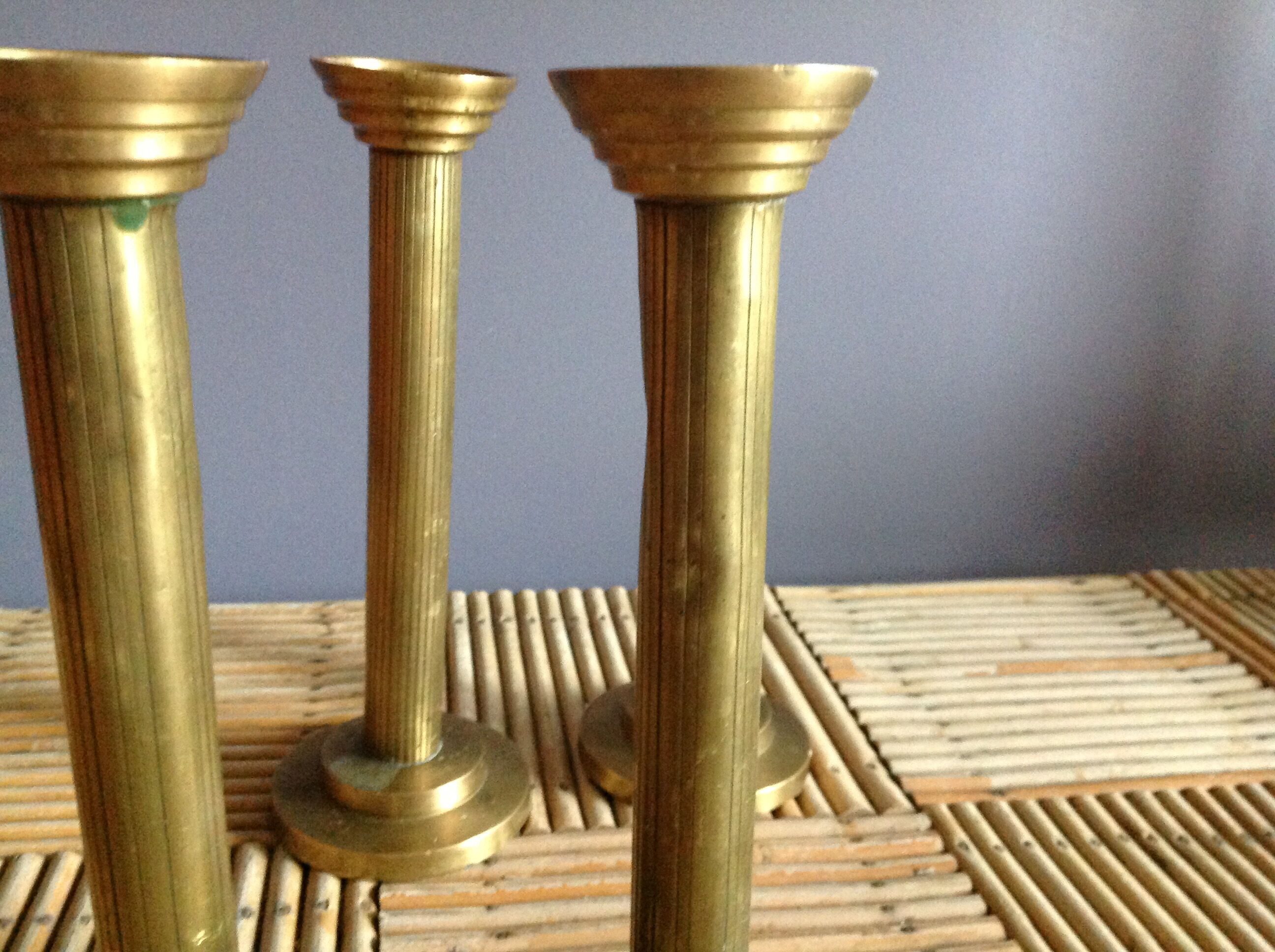 Series of 4 brass candlesticks