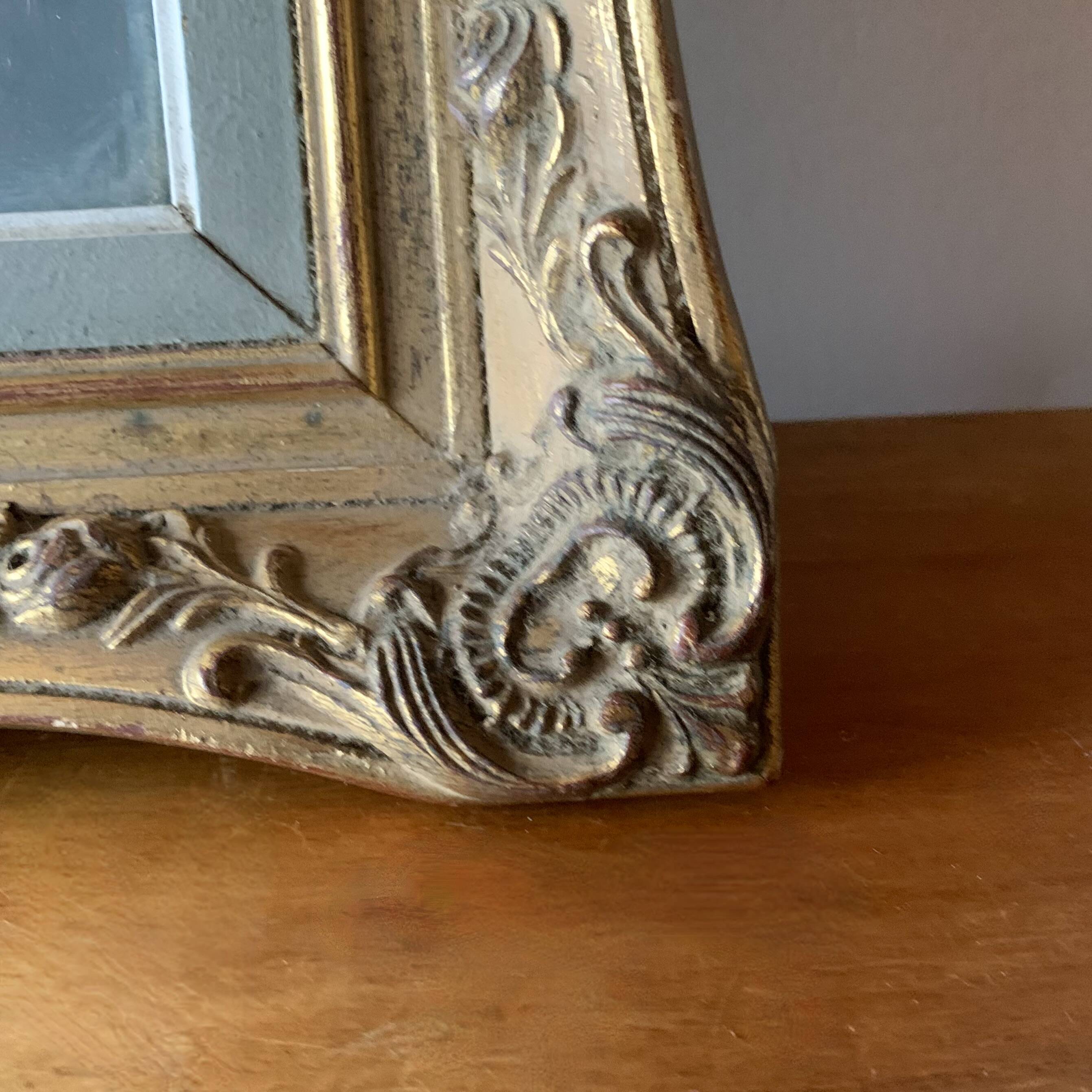 Old gilded carved wooden wall frame
