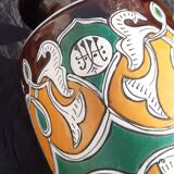 pair of old vases with art deco motifs
