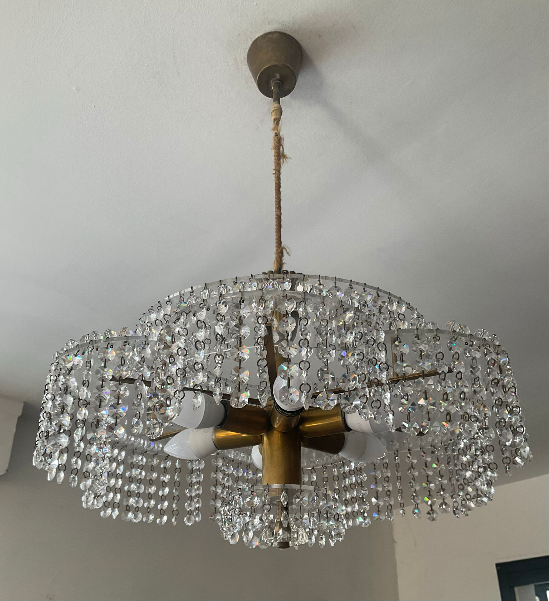 Vintage lucite chandelier with a cascade of crystal pendants from the 1970s.