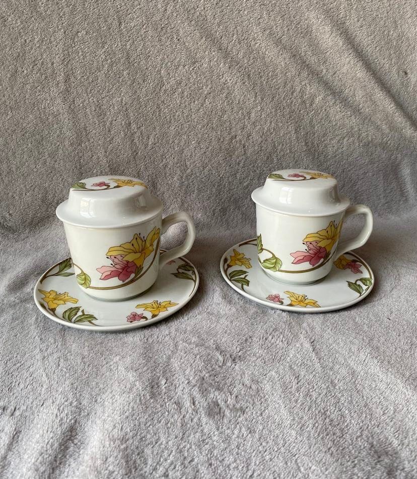 Two cups with herbal tea from the Faiencerie of Pillivuyt
