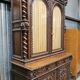 Two-body buffet in solid oak, richly carved in the Renaissance style.
