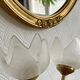 Pair of tulip-shaped candle holders in frosted glass and brass.