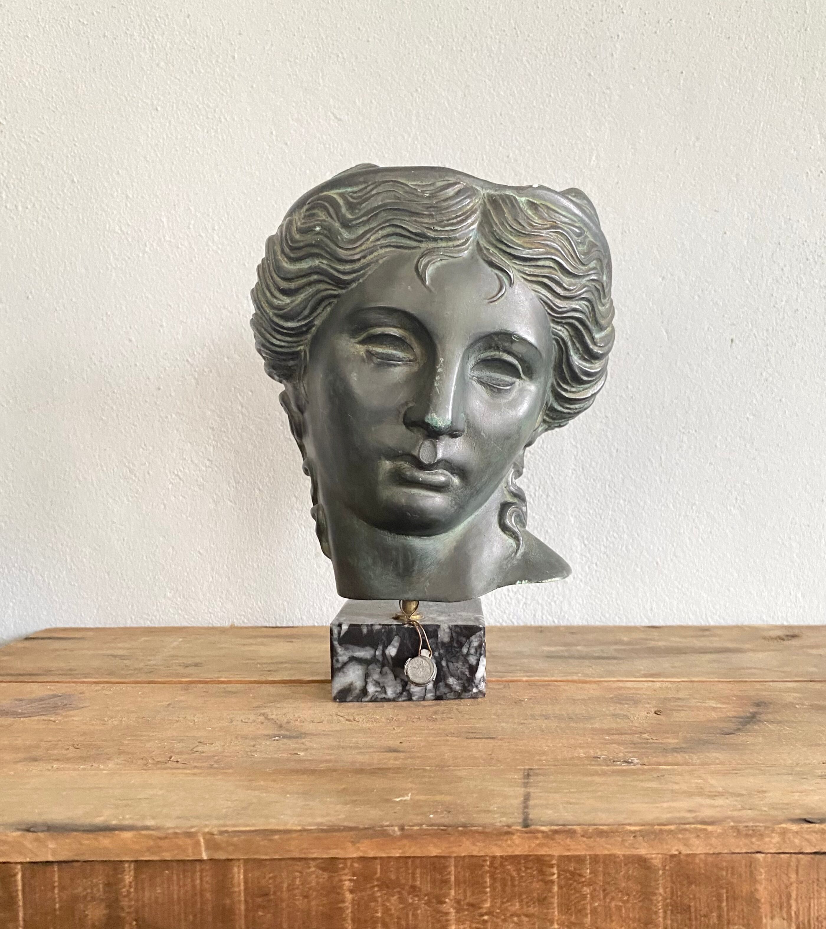 Greek head in patinated plaster with marble base
