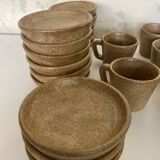 Set of stoneware coffee cups with saucers.