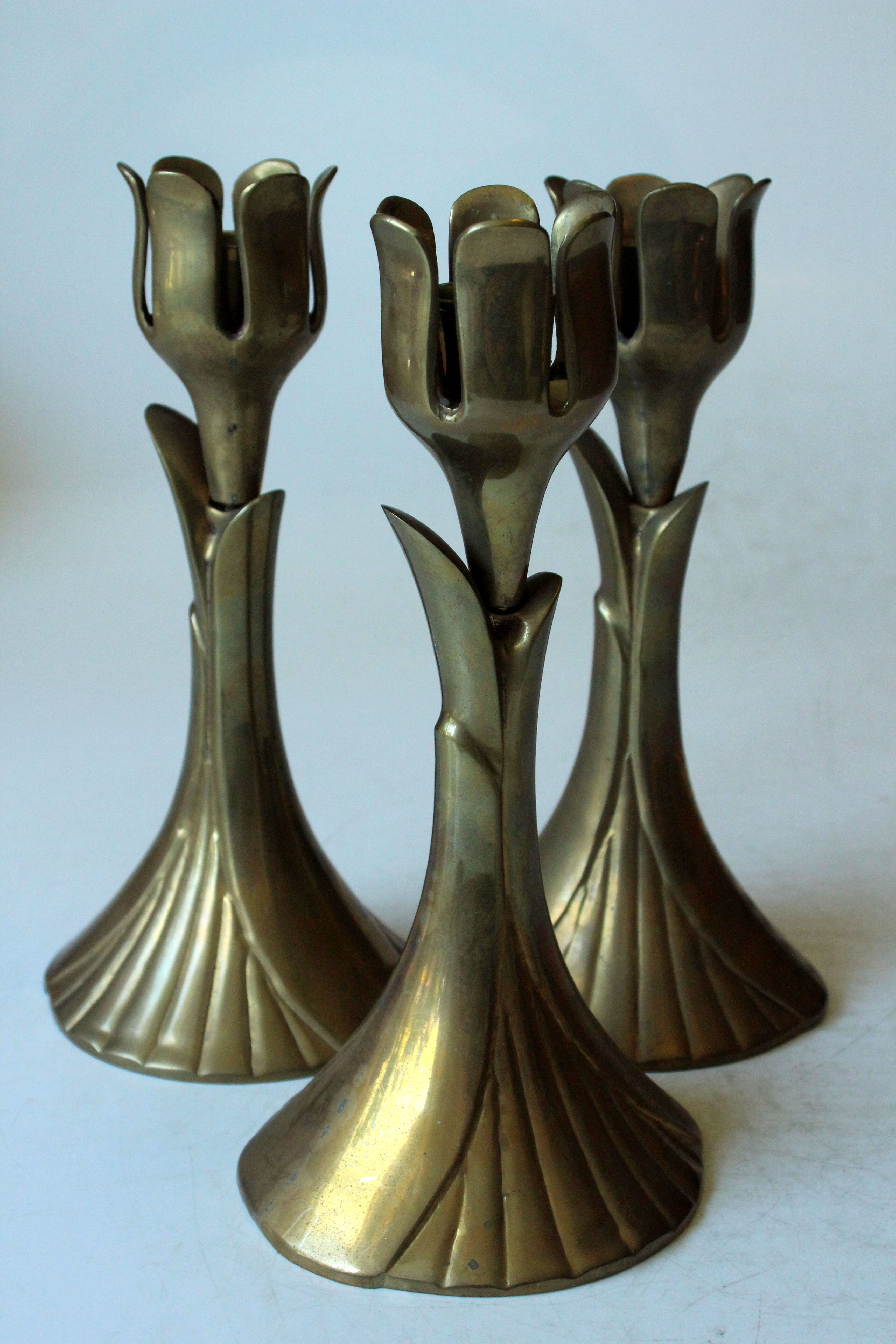 3 beautifull solid brass candle holders with floral motif, vintage from the 1960s