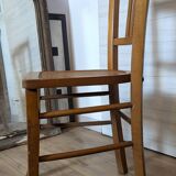 Antique patinated wooden bistro chair from the early 20th century.