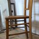 Antique patinated wooden bistro chair from the early 20th century.