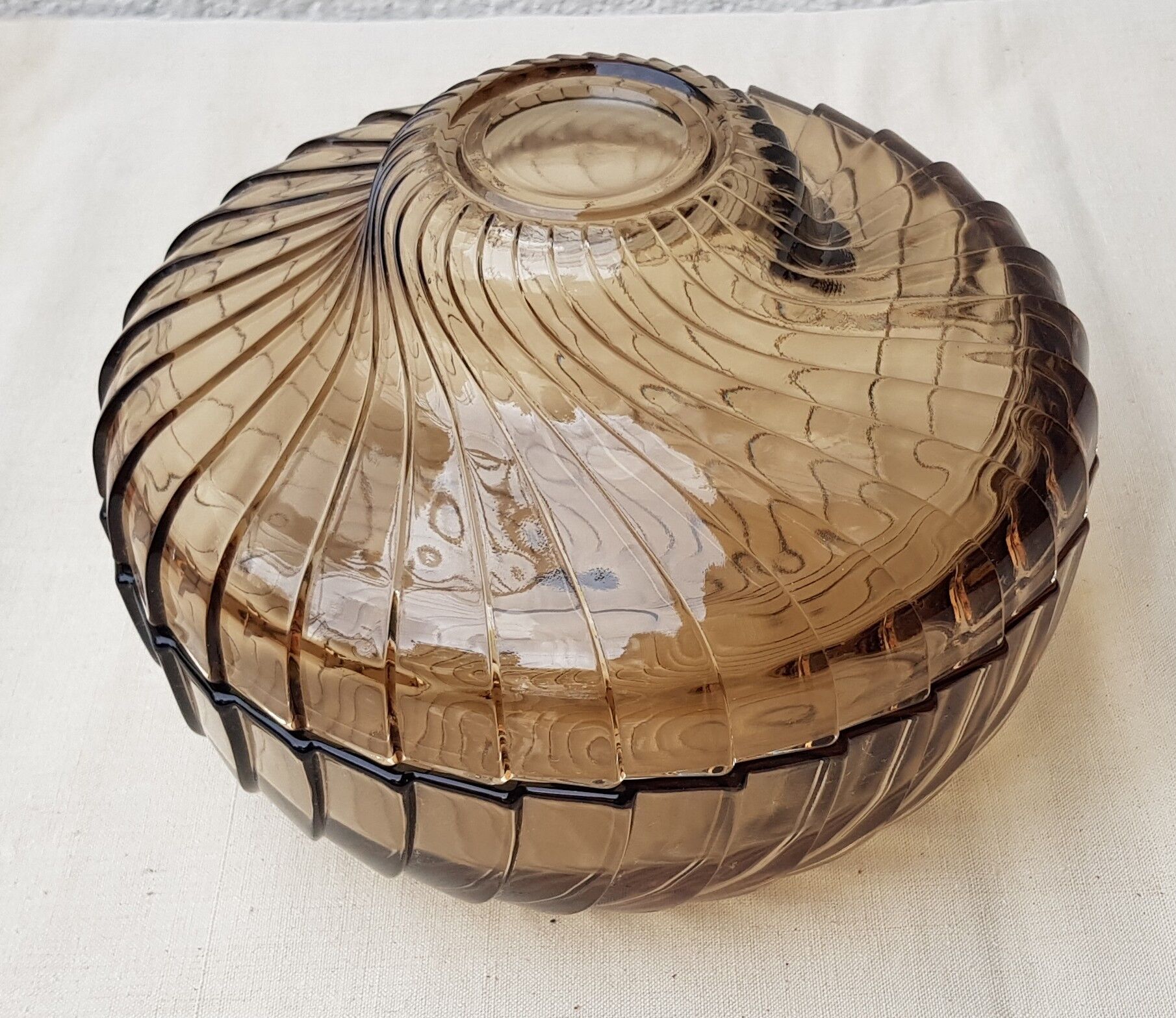 Empty amber glass pocket with lid