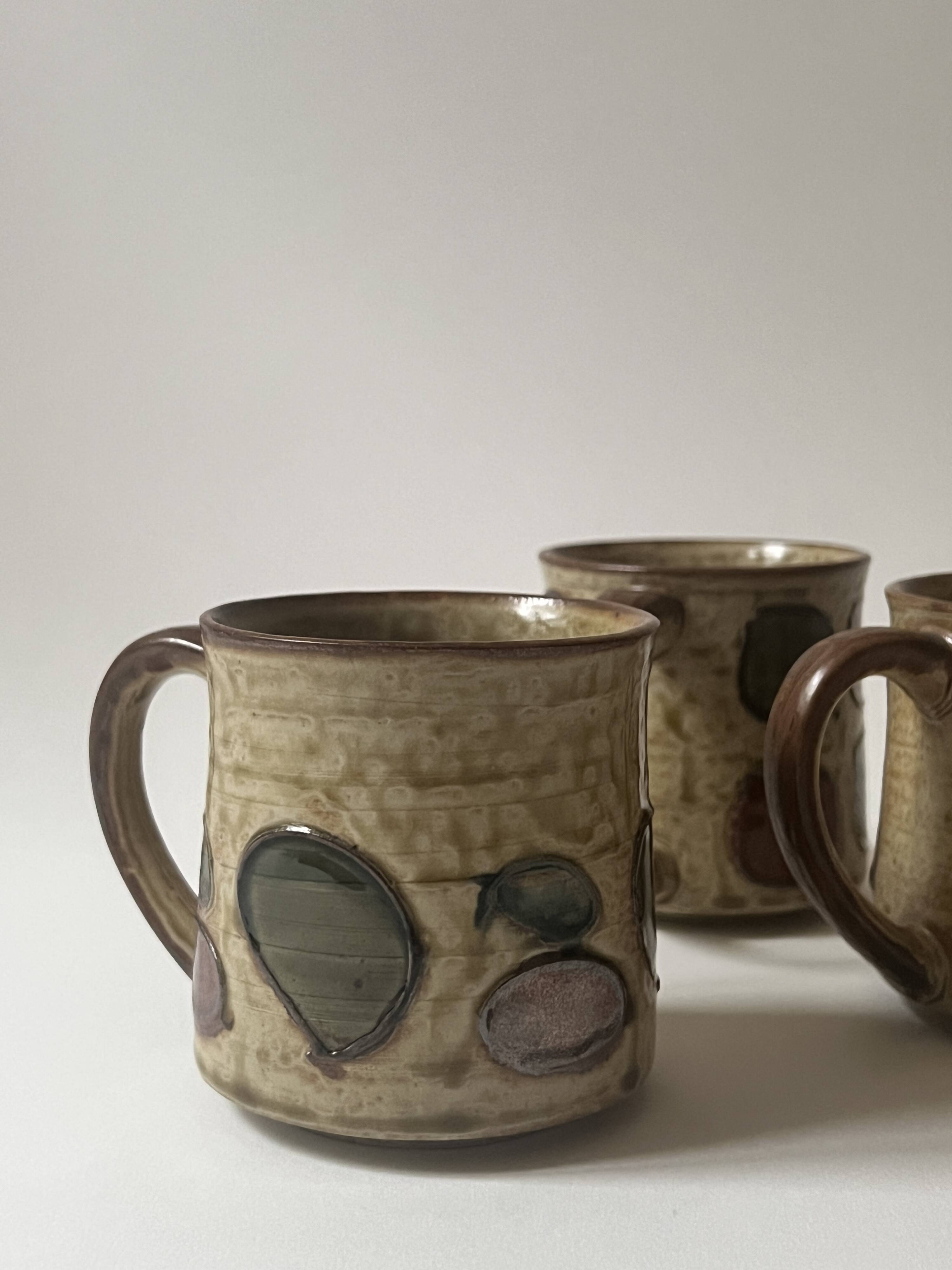 Set of 2 glazed ceramic coffee mugs from around 1970.