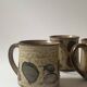 Set of 2 glazed ceramic coffee mugs from around 1970.