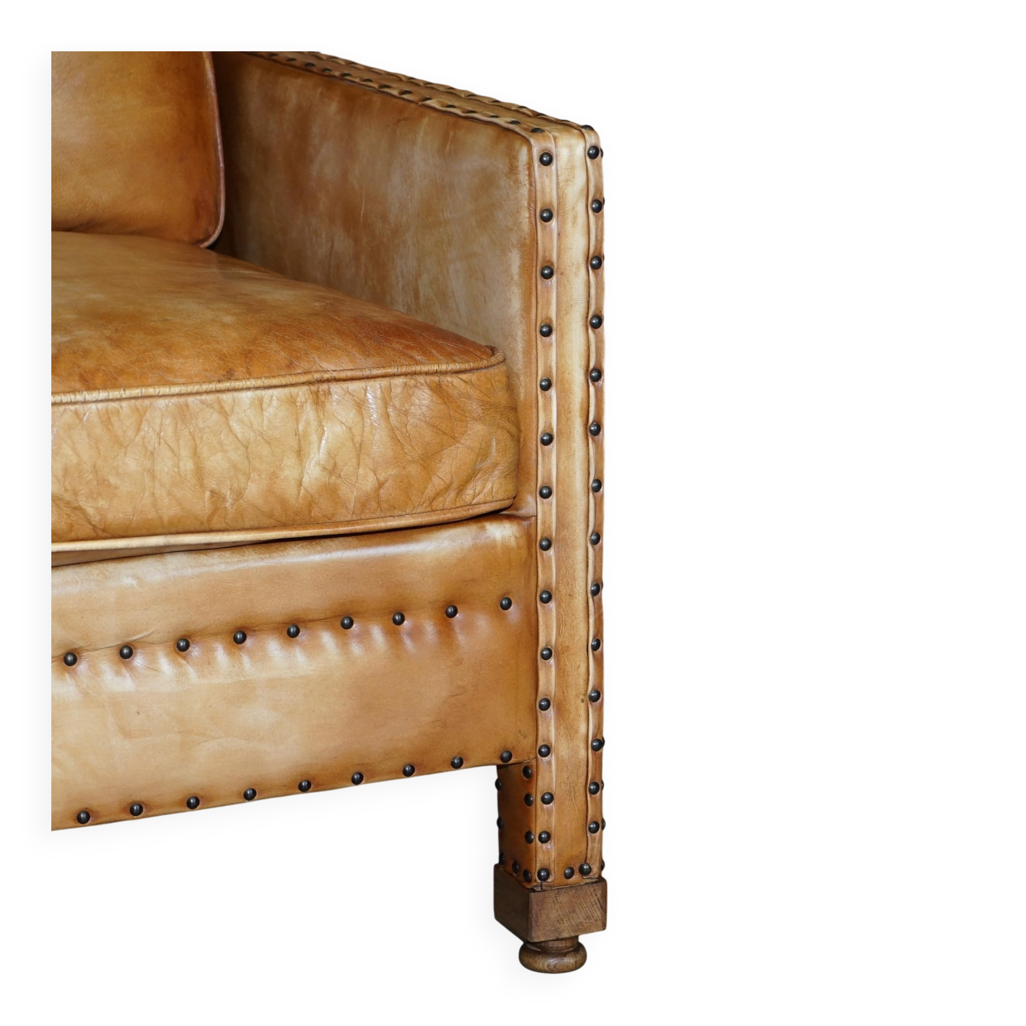 Two-seater leather canapé, hand-tanned, Edwardian style with studs.