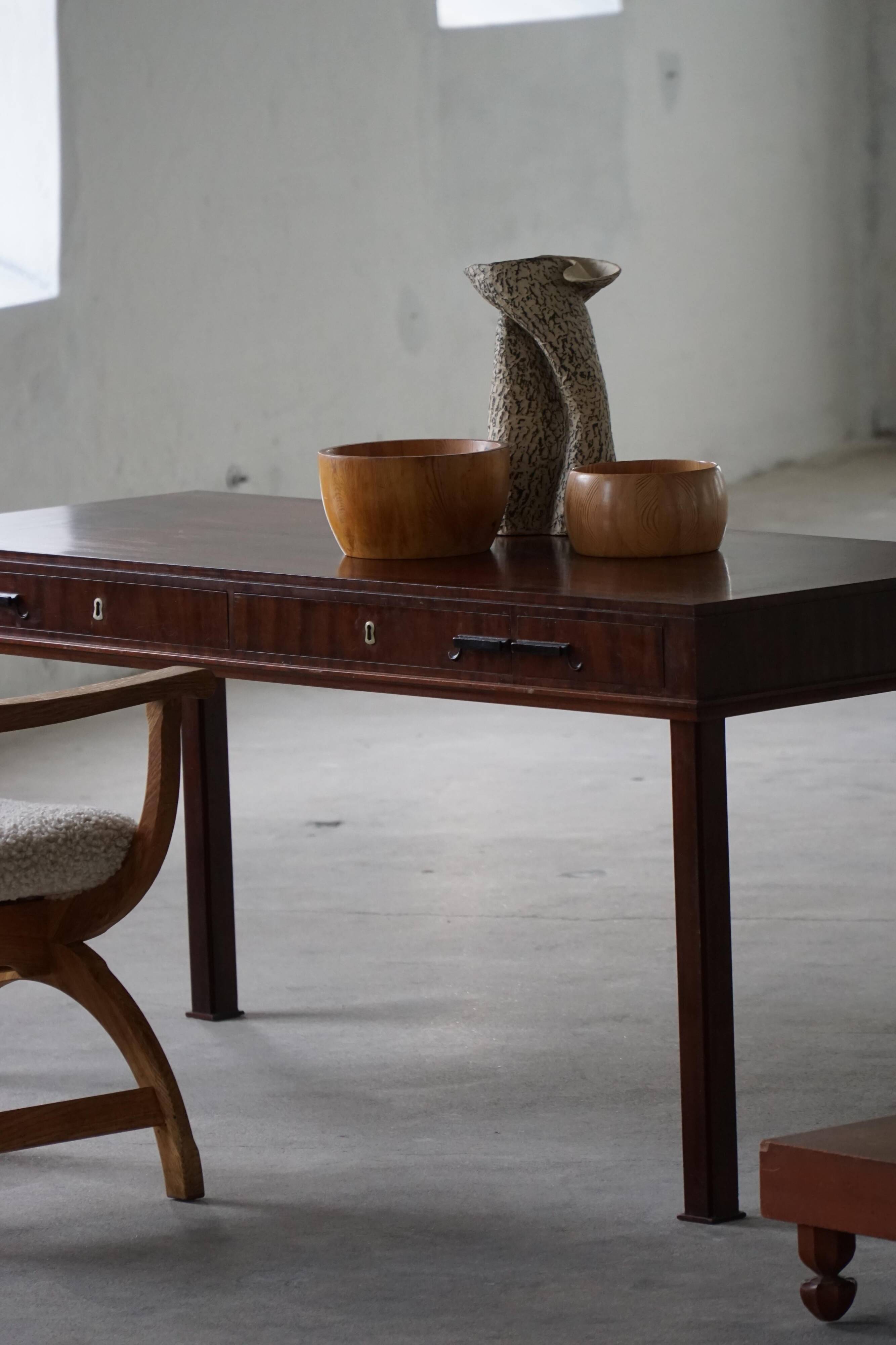 Mid-20th century mahogany writing desk by a Danish cabinetmaker, 1950s.