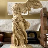 "Winged Victory of Samothrace", beige plaster statuette