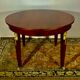 Empire style round table in mahogany